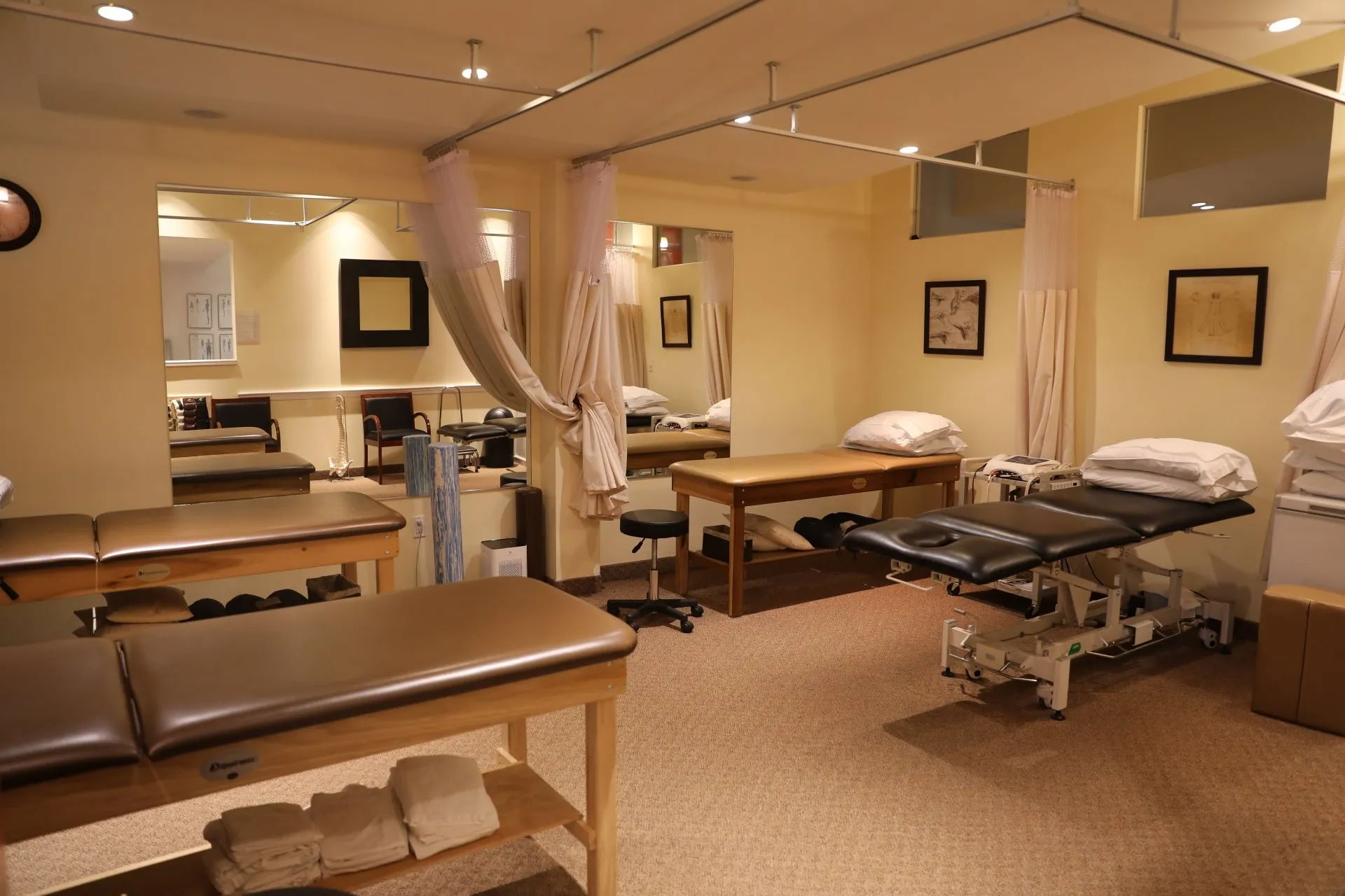 A physical therapy office, with tables for clients around the room