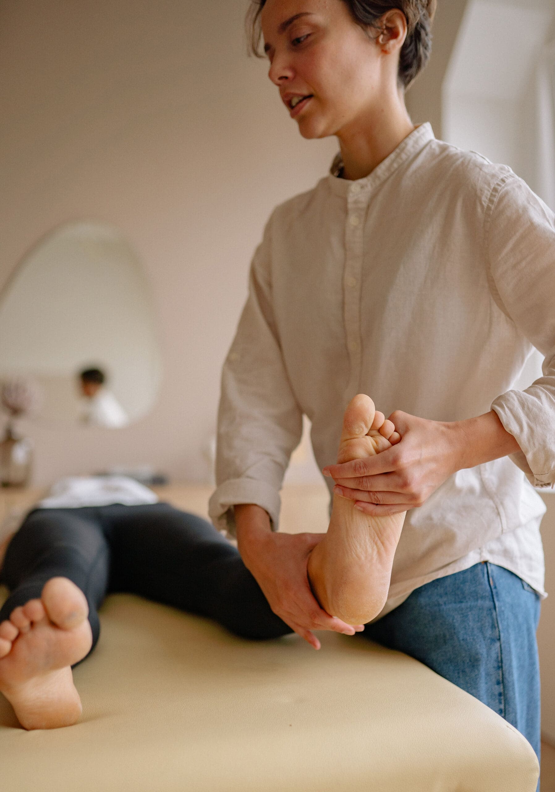 Woman doing physical therapy on foot and ankle