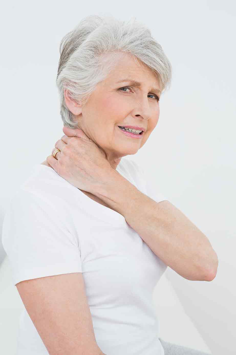 Senior woman holding neck from pain
